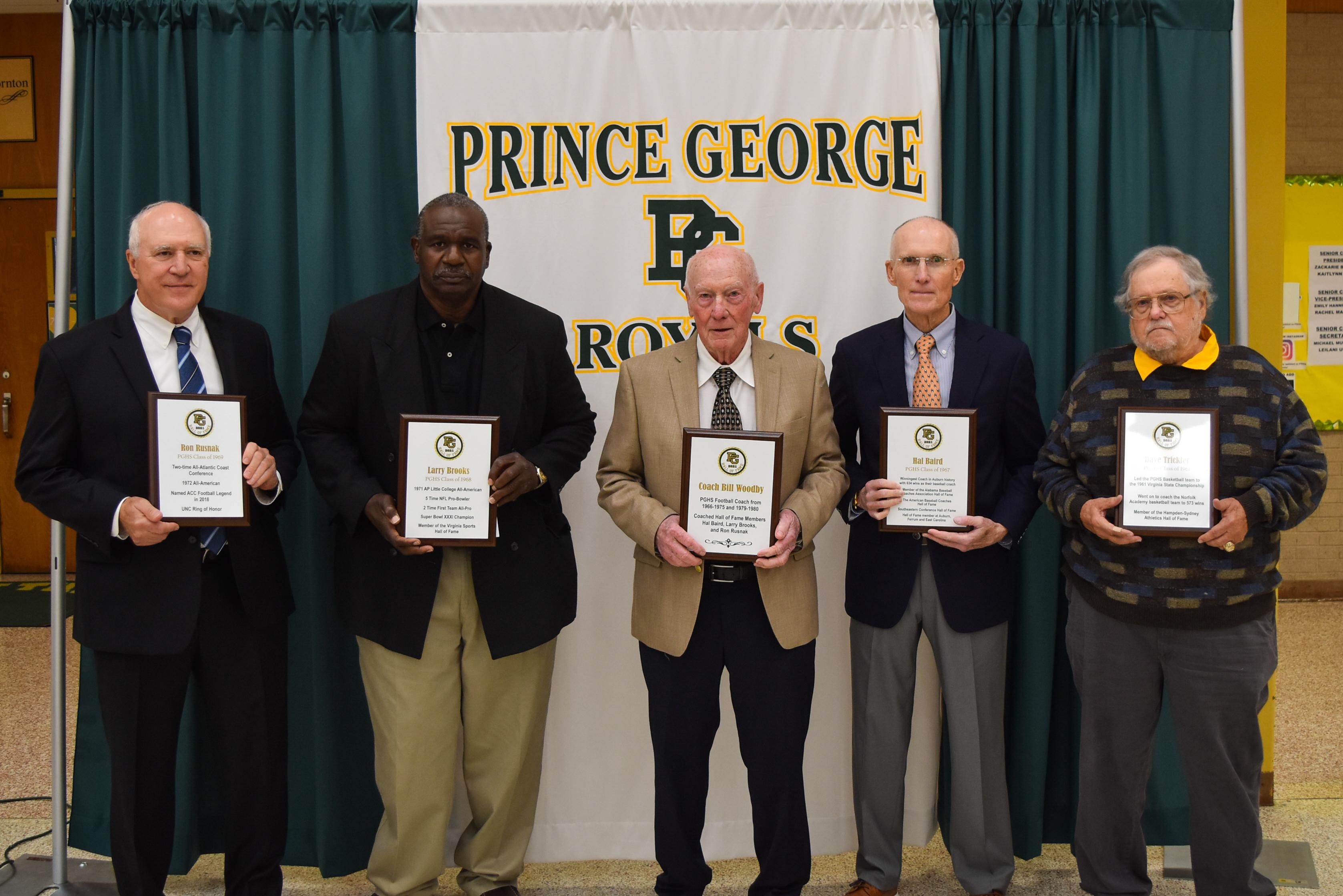 Members of the PGCPS Hall of Fame pose with their plaques following their induction in October 2021